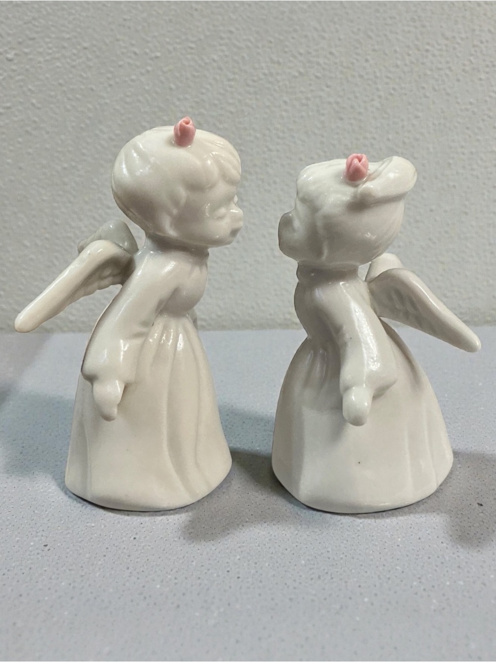 Pair of White Ceramic Kissing Angel Figurines